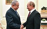 Russian President Vladimir Putin (R) shakes hands with Israeli Prime Minister Benjamin Netanyahu during their meeting at the Kremlin in Moscow on July 11, 2018. (AFP/Pool/Yuri Kadobnov)
