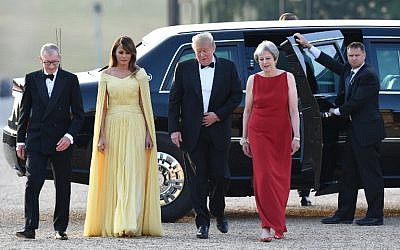 US President Donald Trump (2R) and US First Lady Melania Trump (2L) are welcomed by Britain's Prime Minister Theresa May (R) and her husband Philip May (L) as they arrive for a black-tie dinner with business leaders at Blenheim Palace, west of London, on July 12, 2018, on the first day of President Trump's visit to the UK. (AFP/ POOL / Geoff PUGH)