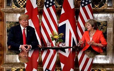 US President Donald Trump listens to Britain's Prime Minister Theresa May prior to a meeting at Chequers, the prime minister's country residence, near Ellesborough, northwest of London on July 13, 2018 on the second day of Trump's UK visit. (AFP/Brendan Smialowski)