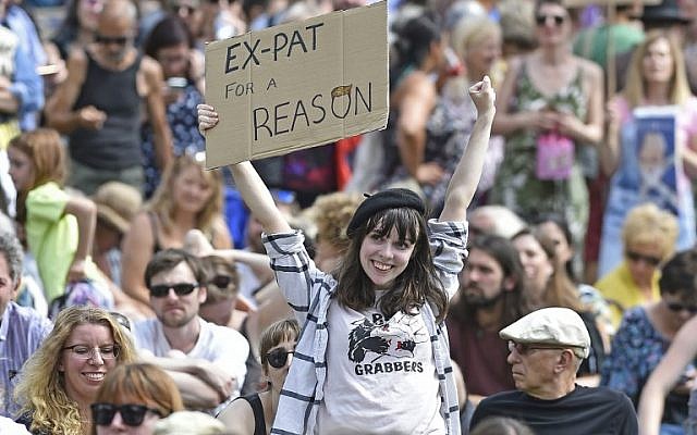 A protester holds up a placard as she takes part in the Scotland United Against Trump demonstration through the streets of Edinburgh, Scotland on July 14, 2018, on the third day of US President Donald Trump's four-day UK visit. (AFP/NEIL HANNA) A protester holds up a placard as she takes part in the Scotland United Against Trump demonstration through the streets of Edinburgh, Scotland on July 14, 2018, on the third day of US President Donald Trump's four-day UK visit. (AFP/NEIL HANNA)
