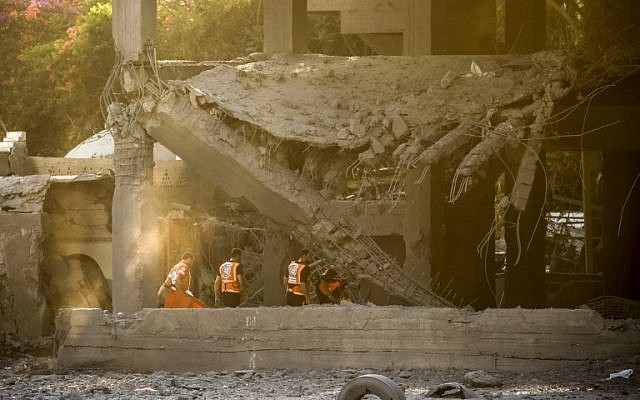 Members of the Palestinian civil defense search for survivors in a building that was hit by Israeli airstrikes (AFP/MAHMUD HAMS) Members of the Palestinian civil defense search for survivors in a building that was hit by Israeli airstrikes (AFP/MAHMUD HAMS)