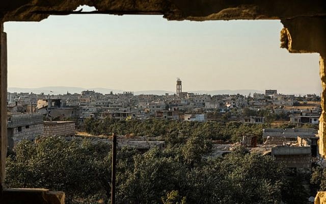 A view of the pro-Syrian government village of Fu'ah in the northwestern province of Idlib, July 17, 2018. (OMAR HAJ KADOUR/AFP) A view of the pro-Syrian government village of Fu'ah in the northwestern province of Idlib, July 17, 2018. (OMAR HAJ KADOUR/AFP)
