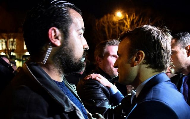 A picture taken on February 28, 2017 shows then French presidential election candidate for the En Marche! movement Emmanuel Macron (R) and Head of Security Alexandre Benalla (L) arriving for a campaign meeting in Angers, western France. (AFP/Jean-Francois Monier) A picture taken on February 28, 2017 shows then French presidential election candidate for the En Marche! movement Emmanuel Macron (R) and Head of Security Alexandre Benalla (L) arriving for a campaign meeting in Angers, western France. (AFP/Jean-Francois Monier)