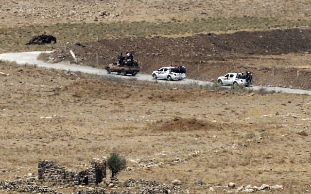 A picture taken on July 20, 2018, from the Israeli Golan Heights shows civilians leaving the Syrian village of Qahtaniyah in the southwestern Quneitra province. (AFP Photo/Jalaa Marey) A picture taken on July 20, 2018, from the Israeli Golan Heights shows civilians leaving the Syrian village of Qahtaniyah in the southwestern Quneitra province. (AFP Photo/Jalaa Marey)