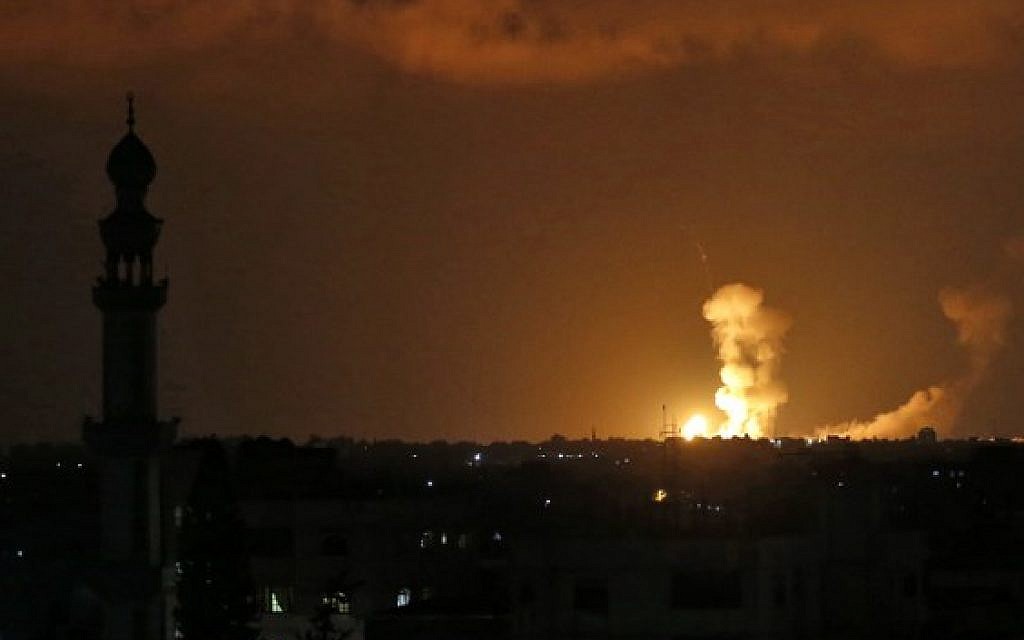 Explosions are seen following Israeli strikes in Khan Younis in the southern Gaza Strip on July 20, 2018. (AFP Photo/Said Khatib)