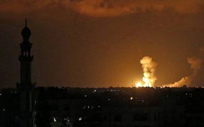 Explosions are seen following Israeli strikes in Khan Younis in the southern Gaza Strip on July 20, 2018. (AFP Photo/Said Khatib)