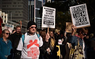 Demonstrators march during a protest to demand humane treatment of asylum seekers and refugees, in Sydney on July 21, 2018. (AFP PHOTO / PETER PARKS)