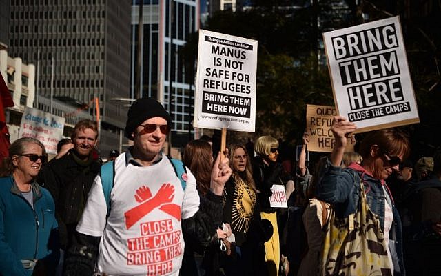 Demonstrators march during a protest to demand humane treatment of asylum seekers and refugees, in Sydney on July 21, 2018. (AFP PHOTO / PETER PARKS) Demonstrators march during a protest to demand humane treatment of asylum seekers and refugees, in Sydney on July 21, 2018. (AFP PHOTO / PETER PARKS)