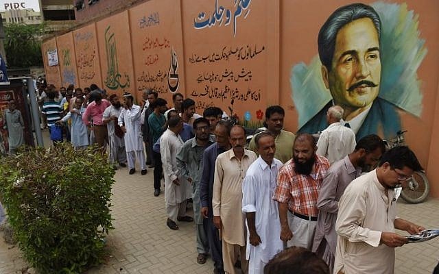 Pakistani election officials wait outside a distribution center to collect ballot boxes and voting materials in Karachi on July 24, 2018.
Pakistan will hold its general election on July 25 (AFP PHOTO / RIZWAN TABASSUM) Pakistani election officials wait outside a distribution center to collect ballot boxes and voting materials in Karachi on July 24, 2018.
Pakistan will hold its general election on July 25 (AFP PHOTO / RIZWAN TABASSUM)