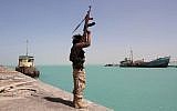 In this file photo taken on February 8, 2017, a member of the pro-government forces raises his weapon in the port of the western Yemeni coastal town of Mokha as the Saudi-backed troops advance in a bid to try to drive the Shiite Houthi rebels away from the Red Sea coast. (AFP Photo/Saleh al-Obeidi)