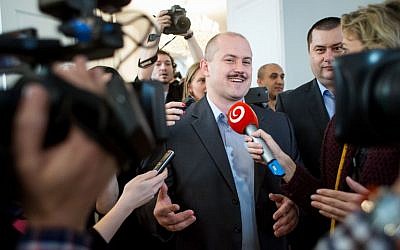 In this file photo taken on March 11, 2016 the leader of the right nationalist LS-Nase Slovensko (Our Slovakia) party Marian Kotleba speaks with journalists before party delegates were intoduced to the parliament in Bratislava. ( AFP PHOTO / VLADIMIR SIMICEK)