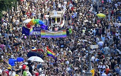 Participants of the Christopher Street Day gay pride parade walk through the streets of Berlin on July 28, 2018. (Tobias SCHWARZ/AFP)
