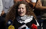 Palestinian teenager Ahed Tamimi speaks at a press conference on the outskirts of the West Bank village of Nabi Saleh on July 29, 2018, after finishing her eight month prison sentence for slapping an Israeli soldier. (AFP Photo/Abbas Momani)