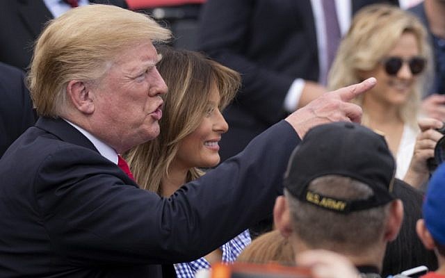 US President Donald Trump and first lady Melania Trump greet guests at a picnic for military families on July 4, 2018 in Washington, DC. (Alex Edelman/Getty Images/AFP) US President Donald Trump and first lady Melania Trump greet guests at a picnic for military families on July 4, 2018 in Washington, DC. (Alex Edelman/Getty Images/AFP)