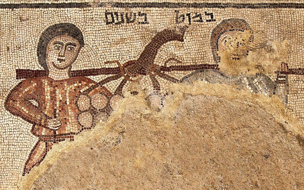 A mosaic found in the 2018 Huqoq excavation is labeled 'a pole between two' and depicts a biblical scene from Numbers 13:23. The images show two spies sent by Moses to explore Canaan carrying a pole with a cluster of grapes. (Jim Haberman)