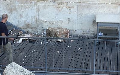 A boulder from the Western Wall falls onto a prayer platform on July 23, 2018 (Courtesy/The Western Wall Heritage Foundation via the Masorti Movement of Israel) A boulder from the Western Wall falls onto a prayer platform on July 23, 2018 (Courtesy/The Western Wall Heritage Foundation via the Masorti Movement of Israel)