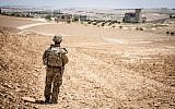 A US soldier provides security during a coordinated, independent patrol along the demarcation line near a village outside Manbij, Syria, June 26, 2018. (US Army photo/Staff Sgt. Timothy R. Koster)