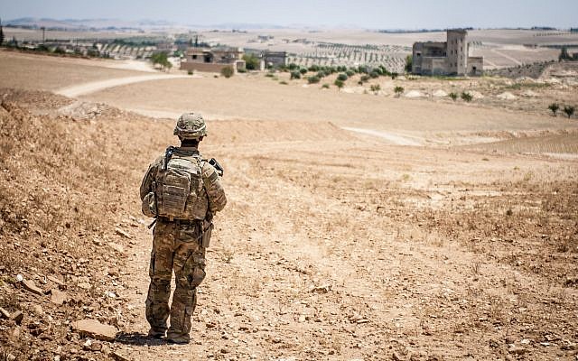 A US soldier provides security during a coordinated, independent patrol along the demarcation line near a village outside Manbij, Syria, June 26, 2018. (US Army photo/Staff Sgt. Timothy R. Koster) A US soldier provides security during a coordinated, independent patrol along the demarcation line near a village outside Manbij, Syria, June 26, 2018. (US Army photo/Staff Sgt. Timothy R. Koster)