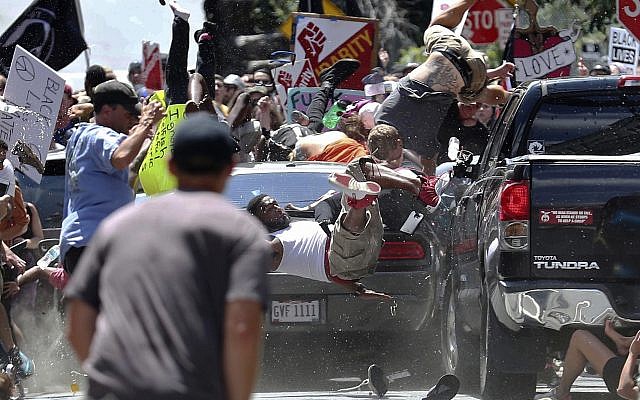In this August 12, 2017, file photo, people fly into the air as a vehicle is driven into a group of protesters demonstrating against a white nationalist rally in Charlottesville, United States. (Ryan M. Kelly/The Daily Progress via AP, File) In this August 12, 2017, file photo, people fly into the air as a vehicle is driven into a group of protesters demonstrating against a white nationalist rally in Charlottesville, United States. (Ryan M. Kelly/The Daily Progress via AP, File)