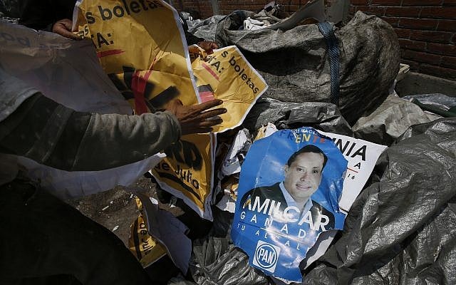Workers collect electoral propaganda at a garbage dump in Mexico City, June 29, 2018. (AP Photo / Marco Ugarte) Workers collect electoral propaganda at a garbage dump in Mexico City, June 29, 2018. (AP Photo / Marco Ugarte)