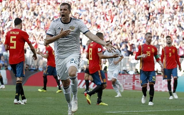 Russia's Artyom Dzyuba celebrates scoring his side's opening goal during the round of 16 match between Spain and Russia at the 2018 soccer World Cup at the Luzhniki Stadium in Moscow, Russia, July 1, 2018. (AP Photo/ Antonio Calanni) Russia's Artyom Dzyuba celebrates scoring his side's opening goal during the round of 16 match between Spain and Russia at the 2018 soccer World Cup at the Luzhniki Stadium in Moscow, Russia, July 1, 2018. (AP Photo/ Antonio Calanni)