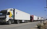 Trucks laden with aid for displaced Syrians wait to cross from Jordan to the Syrian side of the border, in Jabir As Sirhan, Jordan, Sunday, July 1, 2018.  (AP Photo/Omar Akour)