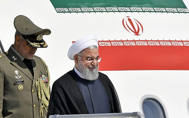 Iranian President Hassan Rouhani, right, arrives at the Zurich airport, in Kloten, Switzerland, July 2, 2018. (KEYSTONE/Walter Bieri via AP) Iranian President Hassan Rouhani, right, arrives at the Zurich airport, in Kloten, Switzerland, July 2, 2018. (KEYSTONE/Walter Bieri via AP)