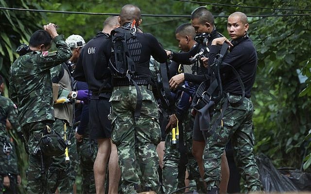 Rescuers prepare dive gear at the entrance to a cave complex in which 12 boys and their soccer coach are trapped in Mae Sai, Chiang Rai province, in northern Thailand, July 4, 2018. (AP Photo/Sakchai Lalit) Rescuers prepare dive gear at the entrance to a cave complex in which 12 boys and their soccer coach are trapped in Mae Sai, Chiang Rai province, in northern Thailand, July 4, 2018. (AP Photo/Sakchai Lalit)