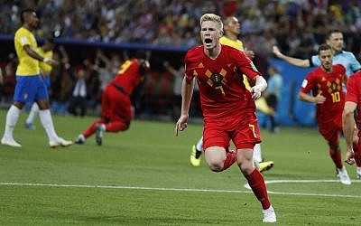 Belgium's Kevin De Bruyne, center, celebrates after scoring his side's second goal during the quarterfinal match between Brazil and Belgium at the 2018 soccer World Cup in the Kazan Arena, in Kazan, Russia, on July 6, 2018. (AP Photo/Frank Augstein)