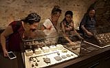 n this Wednesday, June 27, 2018 photo, visitors look at exhibits, entitled "The House of Herod: Life and Power in the Age of the New Testament," at the Terra Sancta Museum in Jerusalem. (AP Photo/Caron Creighton)