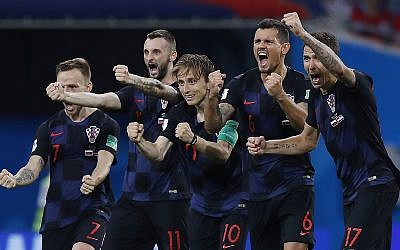 Croatia national soccer team players celebrate after a penalty is saved in a shootout during the quarterfinal match between Russia and Croatia at the 2018 soccer World Cup in the Fisht Stadium, in Sochi, Russia, Saturday, July 7, 2018 (AP Photo/Manu Fernandez)