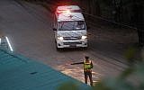 One of two ambulances leaves a cave in northern Thailand hours after an operation begins to rescue trapped youth soccer players and their coach, in Mae Sai, Chiang Rai province, in northern Thailand, July 8, 2018 (AP Photo/Sakchai Lalit)