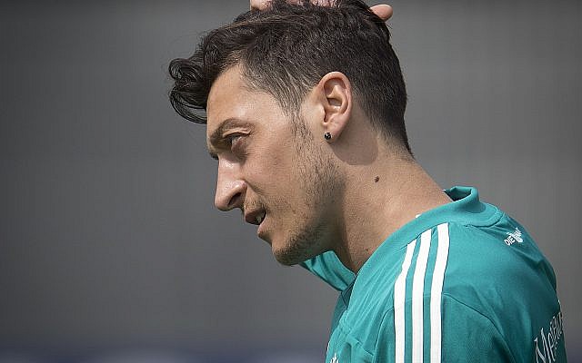 In this June 14, 2018, photo Mesut Ozil scratches his head during a training session of the German team at the 2018 soccer World Cup in Vatutinki near Moscow, Russia. (AP Photo/Michael Probst) In this June 14, 2018, photo Mesut Ozil scratches his head during a training session of the German team at the 2018 soccer World Cup in Vatutinki near Moscow, Russia. (AP Photo/Michael Probst)