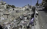 In this July 12, 2018 photo, garbage is strew along an embankment in East Jerusalem. (AP Photo/Mahmoud Illean)