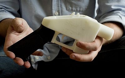 A plastic pistol that was completely made on a 3D-printer at a home in Austin, Texas, May 10, 2013. (Jay Janner/Austin American-Statesman via AP)