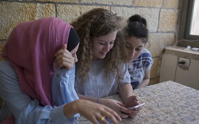 Ahed Tamimi, center, surfs the internet with her friends at the family house in the West Bank village of Nebi Saleh, near Ramallah, Monday, July 30, 2018. (AP Photo/Nasser Nasser) Ahed Tamimi, center, surfs the internet with her friends at the family house in the West Bank village of Nebi Saleh, near Ramallah, Monday, July 30, 2018. (AP Photo/Nasser Nasser)