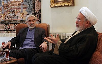 Iranian opposition leaders, Mahdi Karroubi, right, and Mir Hossein Mousavi talk in Tehran, Iran, Oct. 10, 2009. (AP)