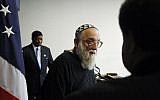 Rabbi Arthur Waskow of the Shalom Center in Philadelphia leaves the podium as Mahdi Bray, Executive Director of Muslim American Society (MAS) Freedom, is seen at rear at a news conference at the National Press Club in Washington, Aug. 17, 2010 (AP Photo/Charles Dharapak)
