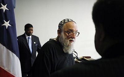 Rabbi Arthur Waskow of the Shalom Center in Philadelphia leaves the podium as Mahdi Bray, Executive Director of Muslim American Society (MAS) Freedom, is seen at rear at a news conference at the National Press Club in Washington, Aug. 17, 2010 (AP Photo/Charles Dharapak)