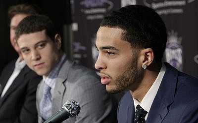 Tyler Honeycutt, the Sacramento Kings second round pick, 35th overall, in Thursday's NBA draft, responds to a question as Jimmer Fredette, left, the Kings first round pick, 10th, overall looks on during a news conference in Sacramento, California, June 25, 2011.  (AP Photo/Rich Pedroncelli)