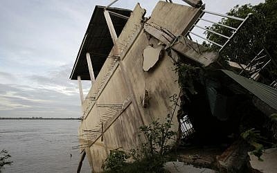 Illustrative image of s local house damaged by floods in Laos in 2011. (AP Photo/Heng Sinith)