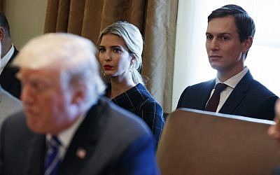 Ivanka Trump, center, and White House senior adviser Jared Kushner, right, listen to US President Donald Trump during a cabinet meeting at the White House, in Washington, November 20, 2017. (Evan Vucci/AP)