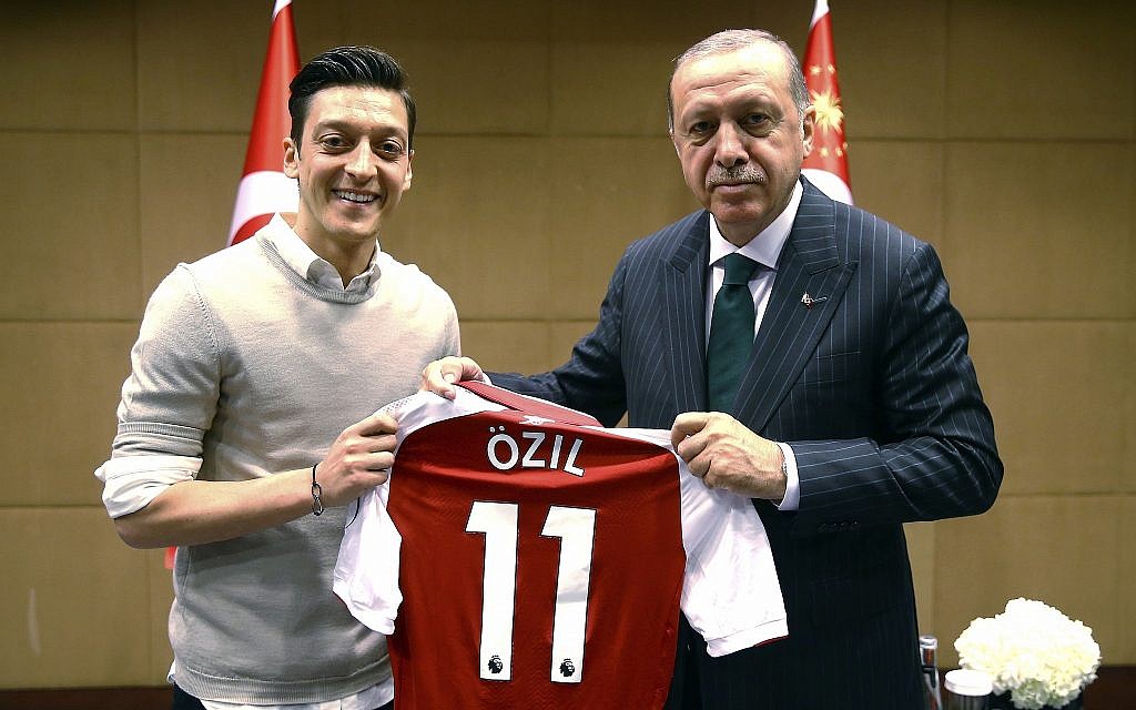 In this photo taken on Sunday, May 13, 2018, Turkey's President Recep Tayyip Erdogan, right, poses for a photo with Turkish-German Arsenal soccer player Mesut Ozil in London. Erdogan started a three-day visit to Britain on Sunday by praising the country as "an ally and a strategic partner, but also a real friend." (Presidential Press Service/Pool via AP) In this photo taken on Sunday, May 13, 2018, Turkey's President Recep Tayyip Erdogan, right, poses for a photo with Turkish-German Arsenal soccer player Mesut Ozil in London. Erdogan started a three-day visit to Britain on Sunday by praising the country as "an ally and a strategic partner, but also a real friend." (Presidential Press Service/Pool via AP)