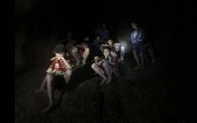 A photo released by Tham Luang Rescue Operation Center, shows the boys and their soccer coach as they were found in a partially flooded cave, in Mae Sai, Chiang Rai, Thailand, July 2, 2018. (Tham Luang Rescue Operation Center via AP) A photo released by Tham Luang Rescue Operation Center, shows the boys and their soccer coach as they were found in a partially flooded cave, in Mae Sai, Chiang Rai, Thailand, July 2, 2018. (Tham Luang Rescue Operation Center via AP)