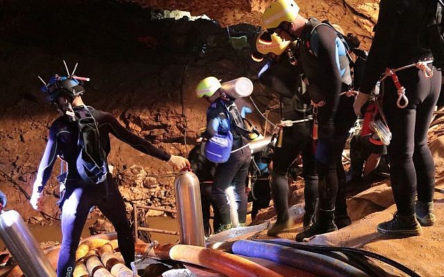 In this undated photo released by Royal Thai Navy on Saturday, July 7, 2018, Thai rescue team members walk inside a cave where 12 boys and their soccer coach have been trapped since June 23, in Mae Sai, Chiang Rai province, northern Thailand (Royal Thai Navy via AP) In this undated photo released by Royal Thai Navy on Saturday, July 7, 2018, Thai rescue team members walk inside a cave where 12 boys and their soccer coach have been trapped since June 23, in Mae Sai, Chiang Rai province, northern Thailand (Royal Thai Navy via AP)