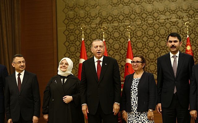 Turkey's President Recep Tayyip Erdogan, center, poses with some members of his newly presented cabinet following a news conference at Presidential Palace, in Ankara, Turkey, Monday, July 9, 2018 (AP Photo/Burhan Ozbilici) Turkey's President Recep Tayyip Erdogan, center, poses with some members of his newly presented cabinet following a news conference at Presidential Palace, in Ankara, Turkey, Monday, July 9, 2018 (AP Photo/Burhan Ozbilici)