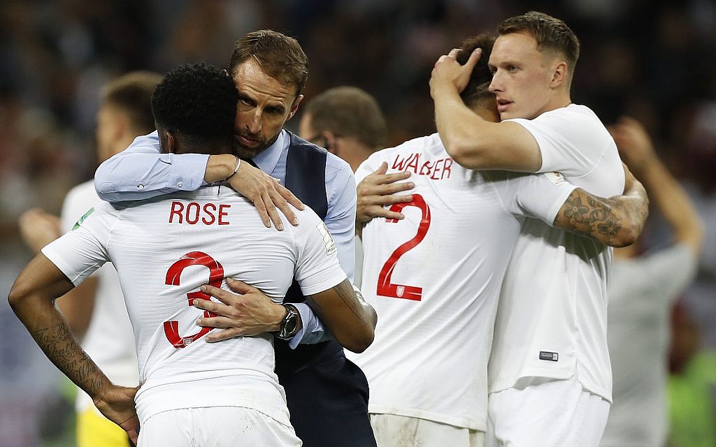 England head coach Gareth Southgate, 2nd left, comforts England's Danny Rose, left, after losing the semifinal match between Croatia and England at the 2018 World Cup in the Luzhniki Stadium in Moscow, Russia, Wednesday, July 11, 2018. (AP Photo/Francisco Seco) England head coach Gareth Southgate, 2nd left, comforts England's Danny Rose, left, after losing the semifinal match between Croatia and England at the 2018 World Cup in the Luzhniki Stadium in Moscow, Russia, Wednesday, July 11, 2018. (AP Photo/Francisco Seco)