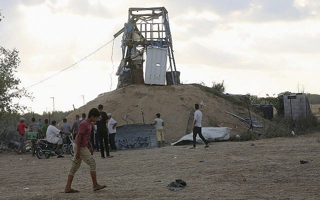 Palestinians inspect a military observation post that was hit by an Israeli tank shell east of Khan Younis, southern Gaza Strip, July 20, 2018 (AP Photo/Adel Hana) Palestinians inspect a military observation post that was hit by an Israeli tank shell east of Khan Younis, southern Gaza Strip, July 20, 2018 (AP Photo/Adel Hana)