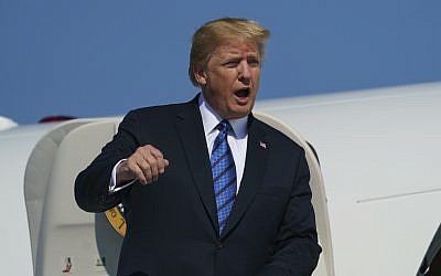 US President Donald Trump arrives on Air Force One at Morristown Municipal Airport, in Morristown, New Jersey, on July 20, 2018, en route to Trump National Golf Club in Bedminster, New Jersey (AP Photo/Carolyn Kaster)