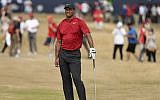 Tiger Woods of the US looks along the 1st fairway during the final round of the British Open Golf Championship in Carnoustie, Scotland, July 22, 2018. (AP Photo/Peter Morrison)